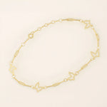 14k yellow gold bracelet featuring open butterfly charms linked with elongated chain links for a delicate look.
