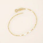 14k yellow gold bracelet with alternating flat bar links and oval cable chain for a sleek, modern design.
