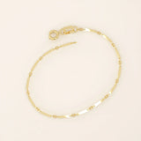 14k yellow gold bracelet with alternating flat bar links and oval cable chain for a sleek, modern design.
