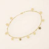 14k yellow gold bracelet with dangling star charms and delicate twisted bead accents along a fine chain.
