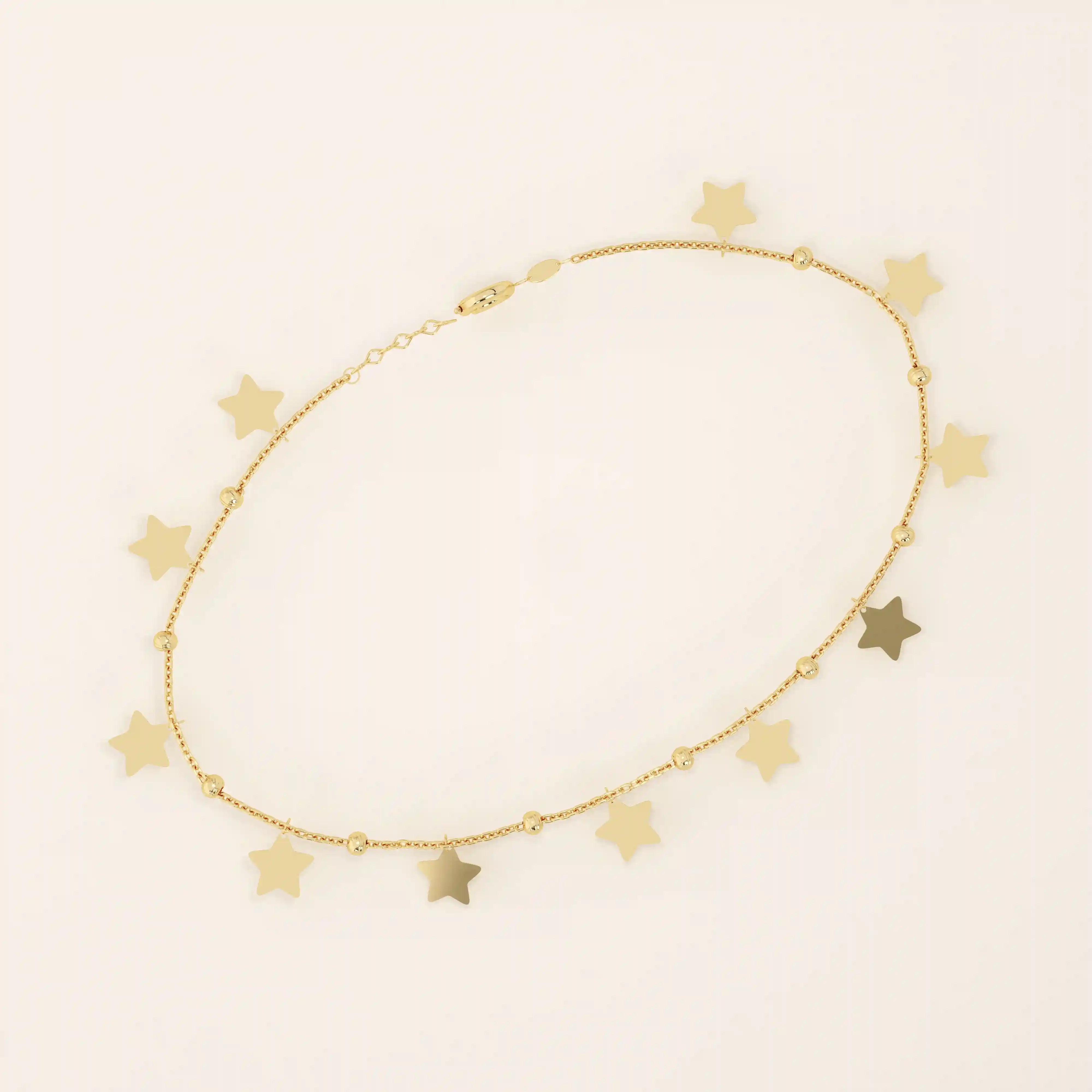 14k yellow gold bracelet with dangling star charms and delicate twisted bead accents along a fine chain.
