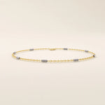 14k yellow gold bracelet with polished oval links and faceted white gold bar accents for a modern contrast.
