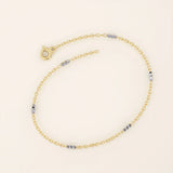 14k yellow gold bracelet with polished oval links and faceted white gold bar accents for a modern contrast.
