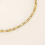 14k yellow gold bracelet with slim elongated links forming a modern link chain design.
