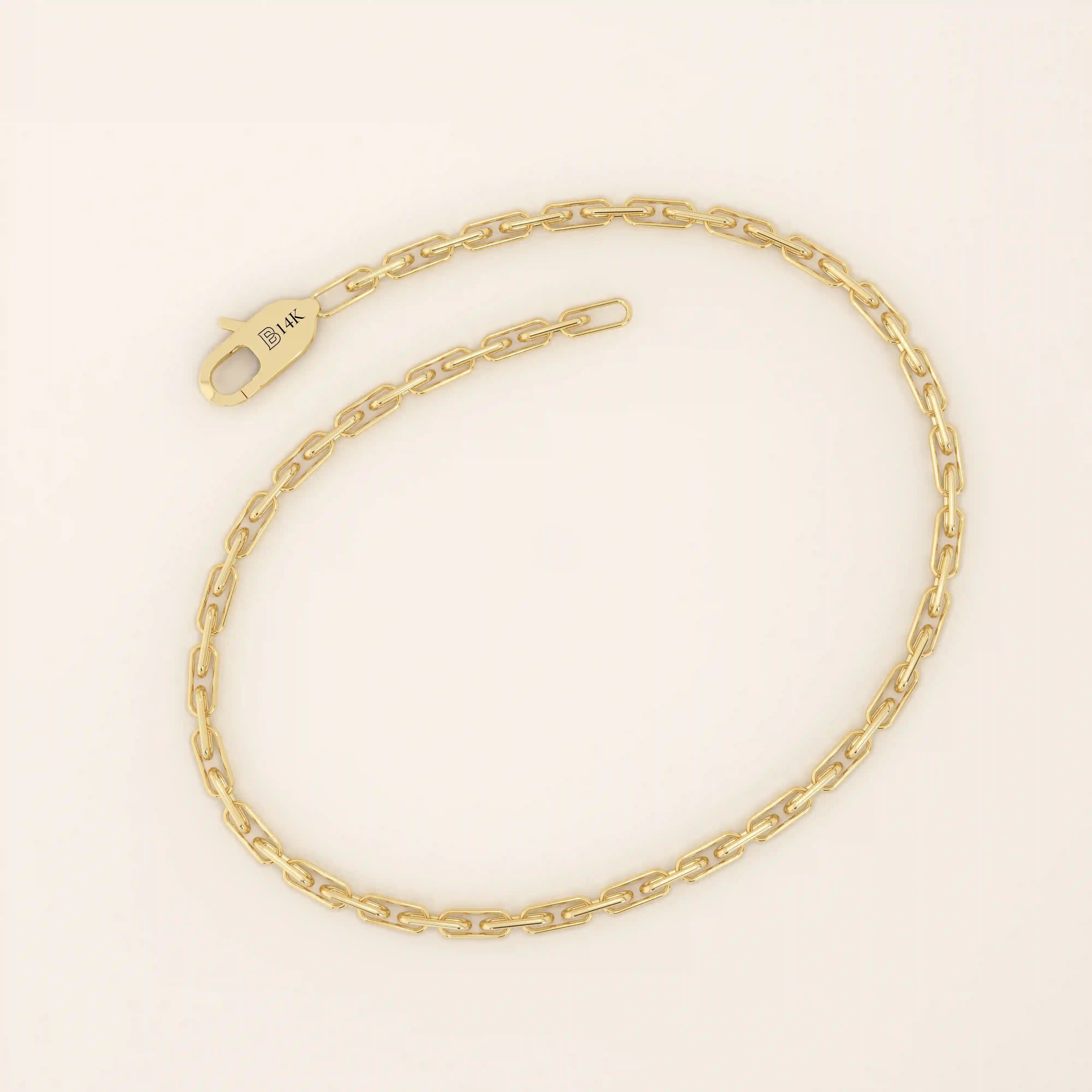 14k yellow gold bracelet with slim elongated links forming a modern link chain design.
