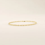 14k yellow gold bracelet with textured circular links featuring a starburst pattern.

