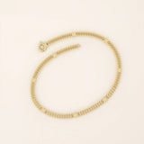 14k yellow gold bracelet with unique flat curb chain links accented by polished round discs.
