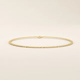 14k yellow gold bracelet with unique flat curb chain links accented by polished round discs.
