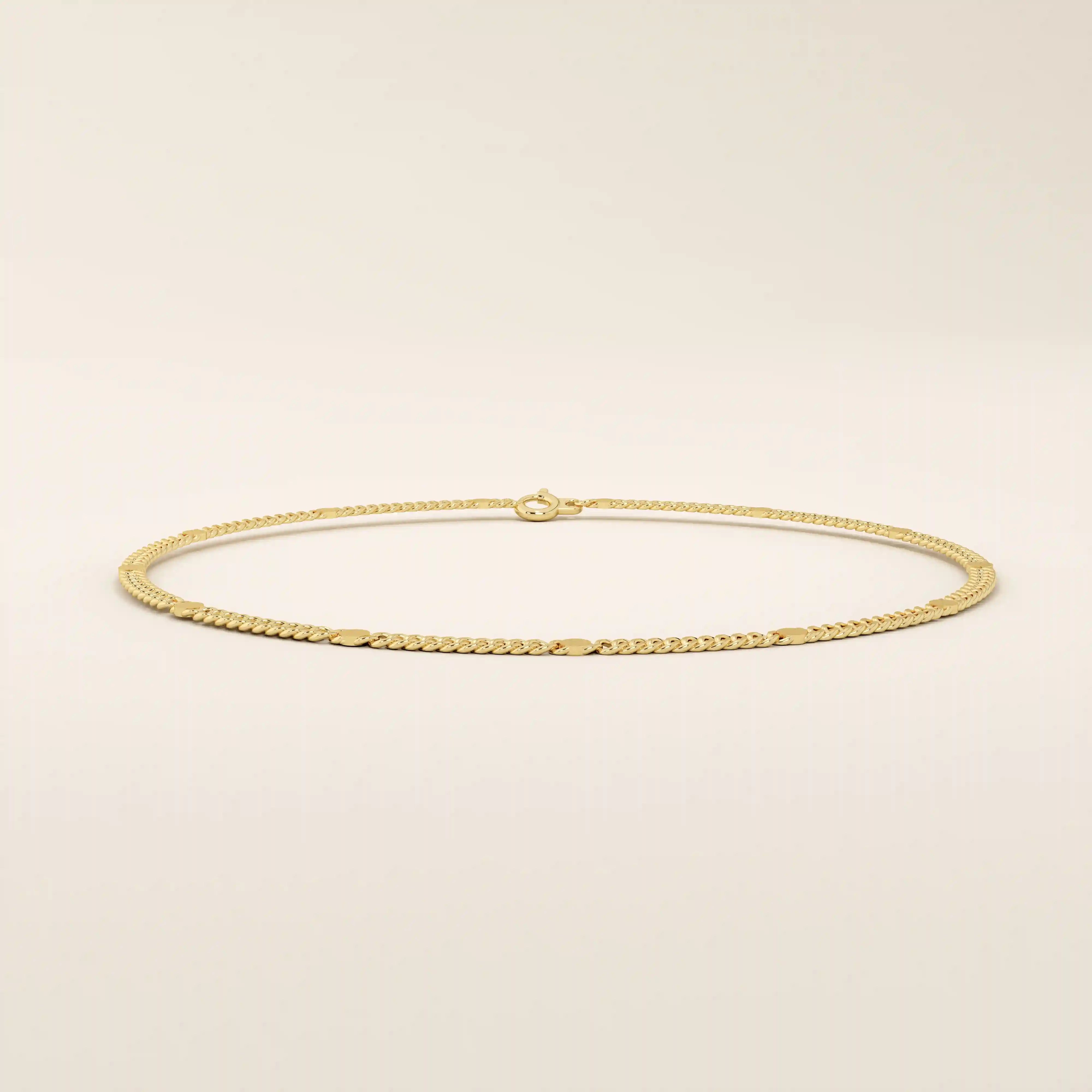 14k yellow gold bracelet with unique flat curb chain links accented by polished round discs.
