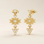14k yellow gold dangling motif stud earrings with geometric star and triangle shapes, accented with moissanite stones.
