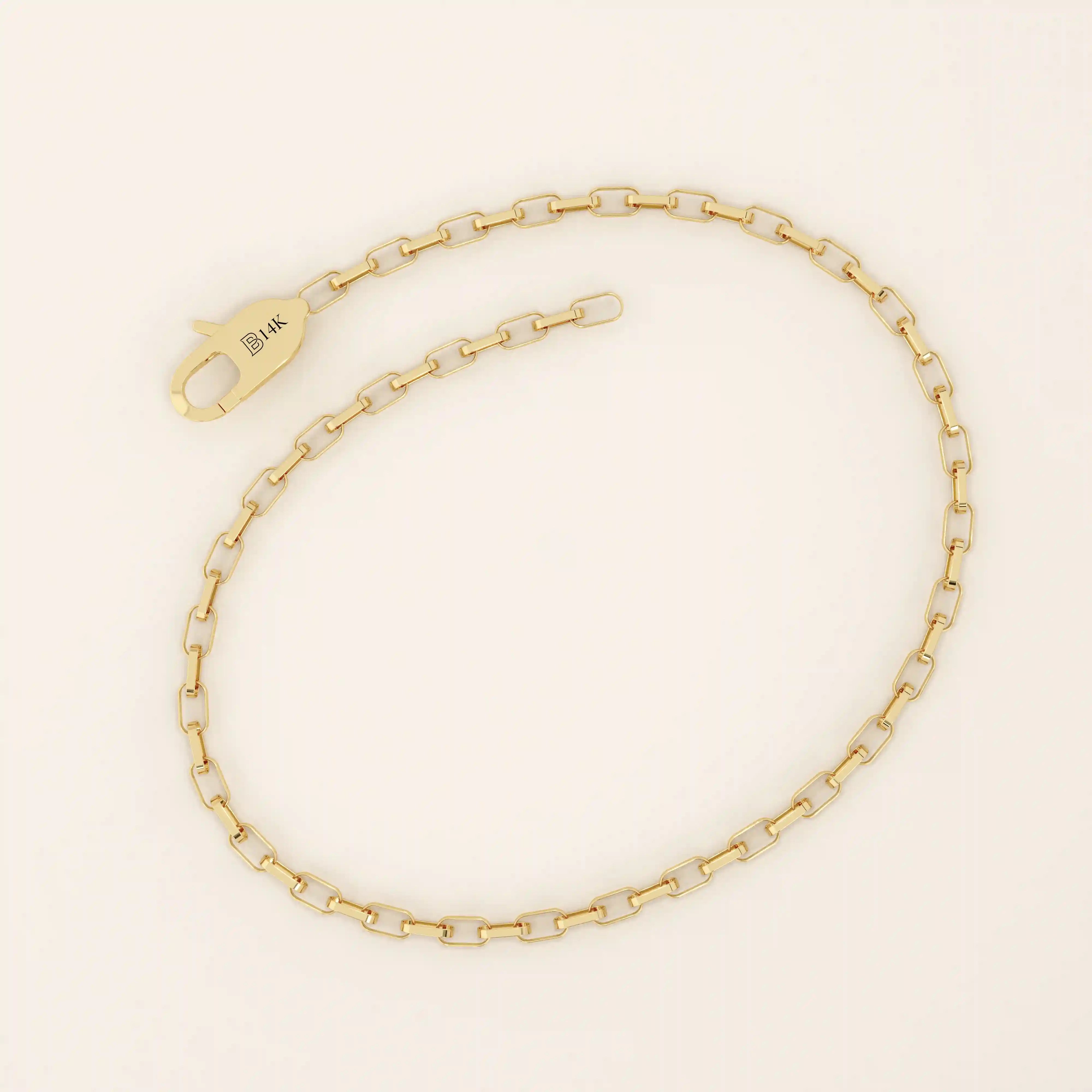 14k yellow gold rolo chain bracelet featuring interlocking rounded rectangular links with a smooth polished finish.
