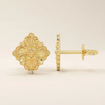 14k yellow gold stud earrings in a vintage-inspired clover shape with embossed floral detailing and polished finish.
