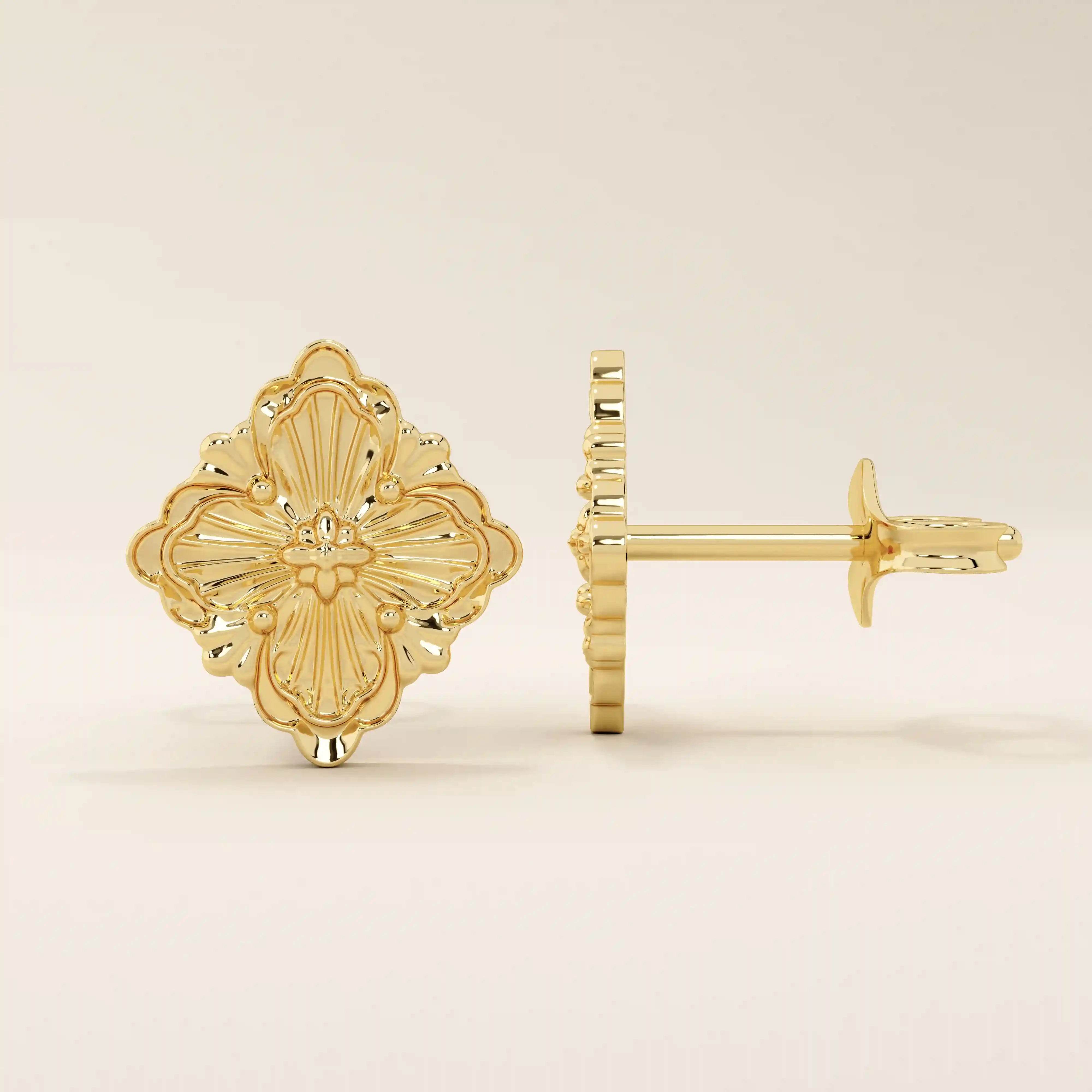 14k yellow gold stud earrings in a vintage-inspired clover shape with embossed floral detailing and polished finish.

