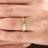 Model wearing a 14k gold vermeil Northstar ring with a cubic zirconia center stone and starburst detailing, minimalist celestial ring for women.
