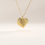 14k gold vermeil 3D heart necklace featuring a sculpted, wavy heart pendant accented with a single sparkling cubic zirconia for a romantic modern touch.
