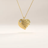 14k gold vermeil 3D heart necklace featuring a sculpted, wavy heart pendant accented with a single sparkling cubic zirconia for a romantic modern touch.
