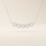 5 stone bezel necklace in 14k white gold with five round brilliant stones in sleek bezel settings.

