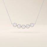 5 stone bezel necklace in 14k white gold with five round brilliant stones in sleek bezel settings.
