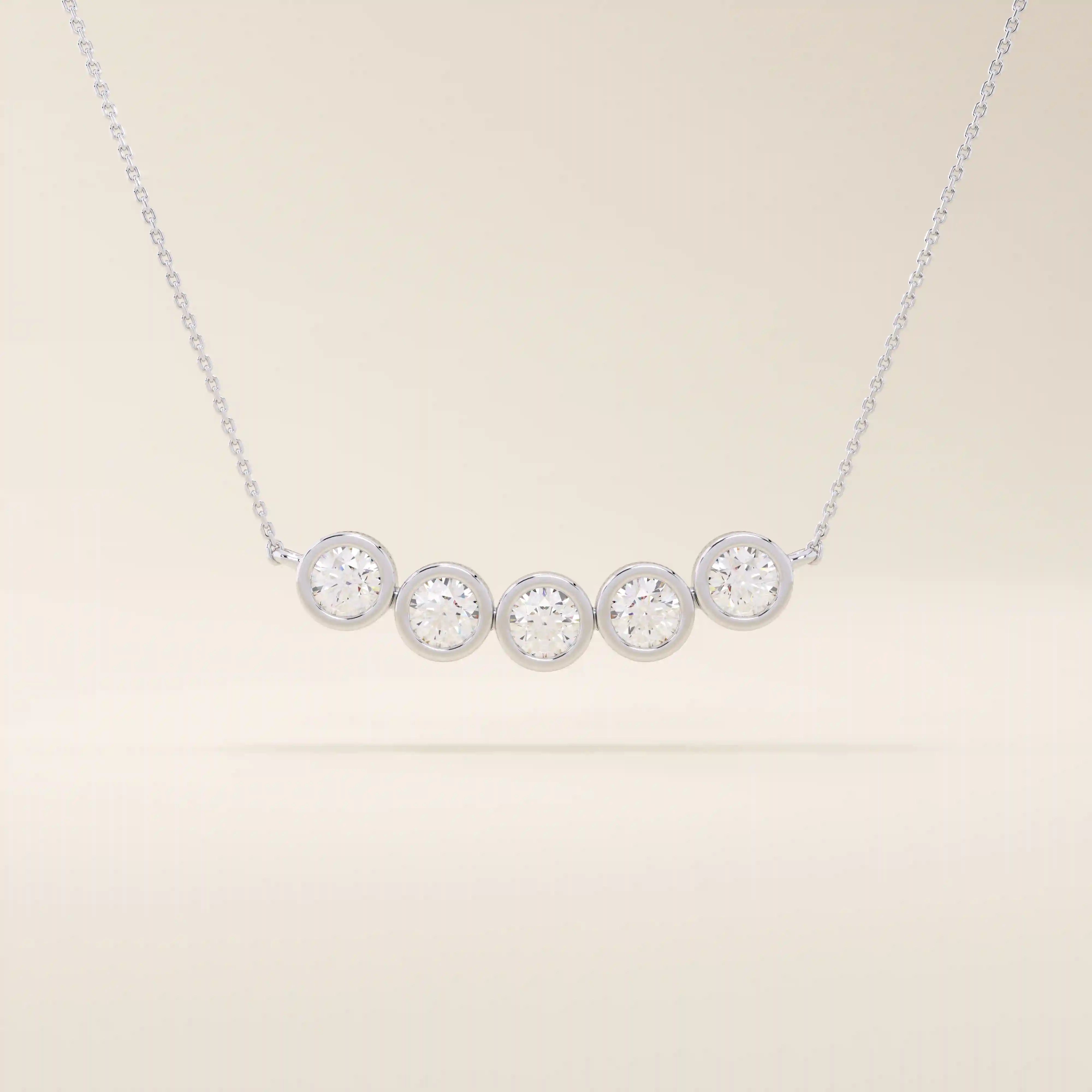 5 stone bezel necklace in 14k white gold with five round brilliant stones in sleek bezel settings.
