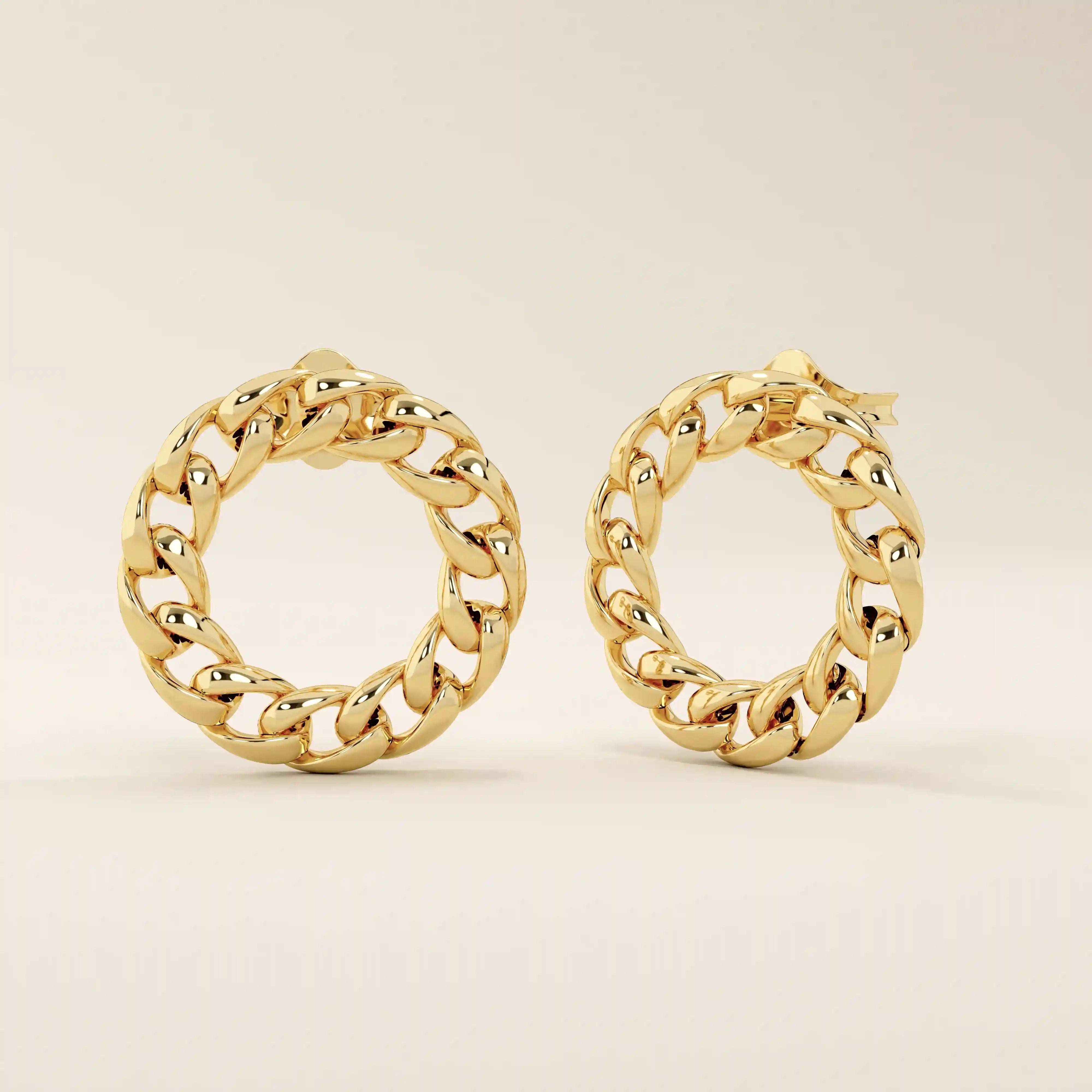 Angled view of 14k solid yellow gold curb chain stud earrings, showcasing the dimensional link texture and gleaming surface.
