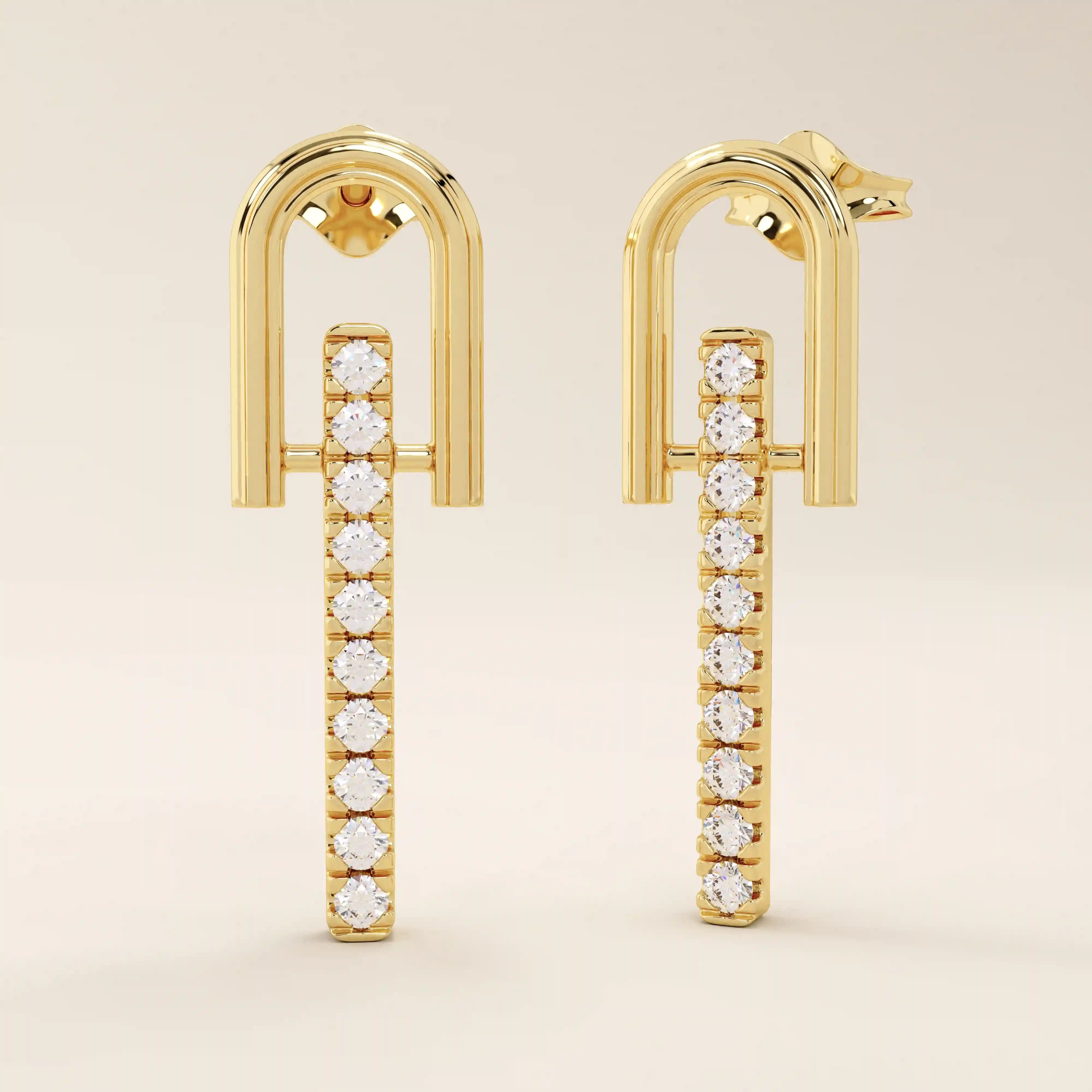 Angled view of 14k solid yellow gold dangling bar stud earrings with a polished U-frame and vertical row of moissanite stones.
