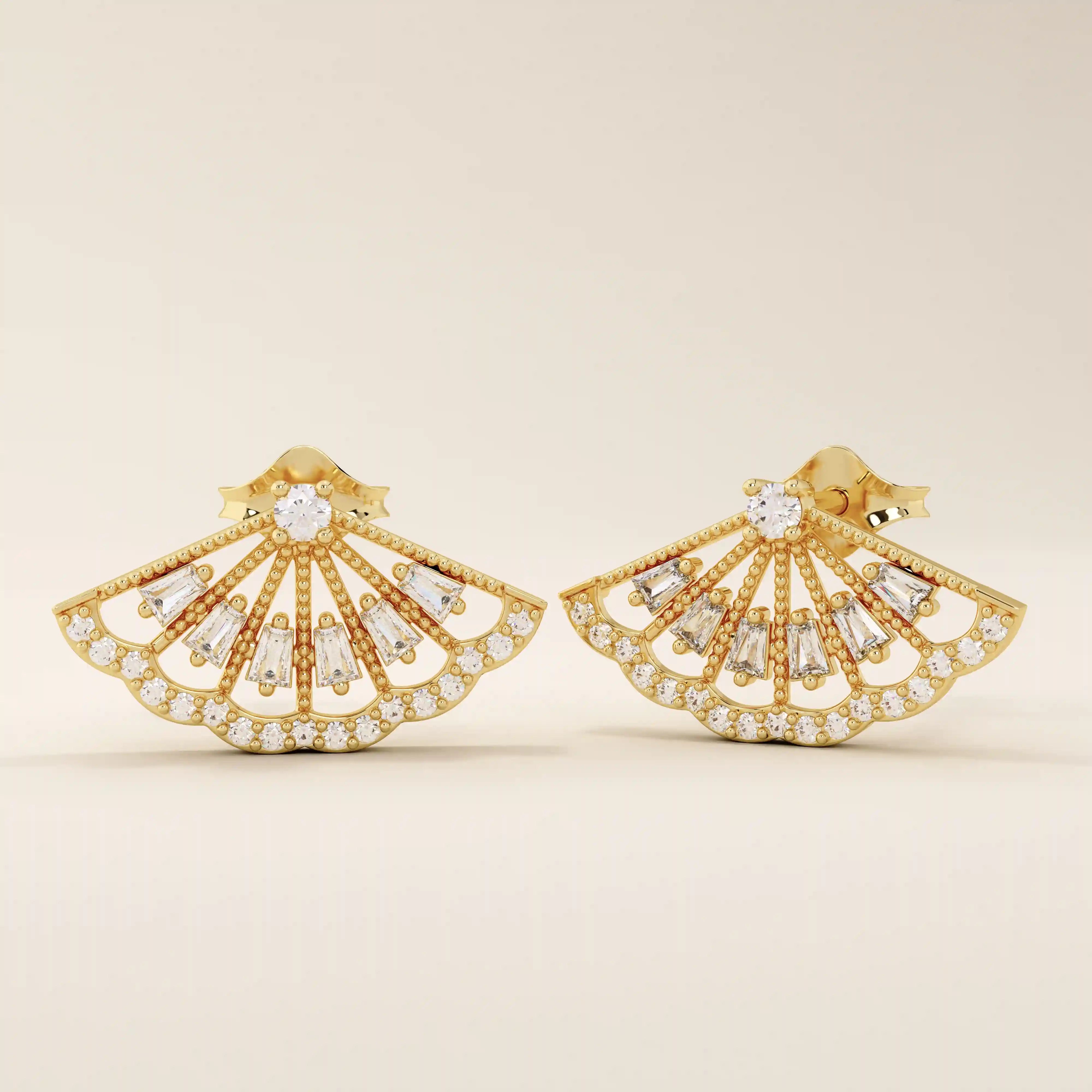 Angled view of 14k solid yellow gold fan stud earrings, showing the dimensional openwork pattern and the brilliance of baguette and round moissanites.

