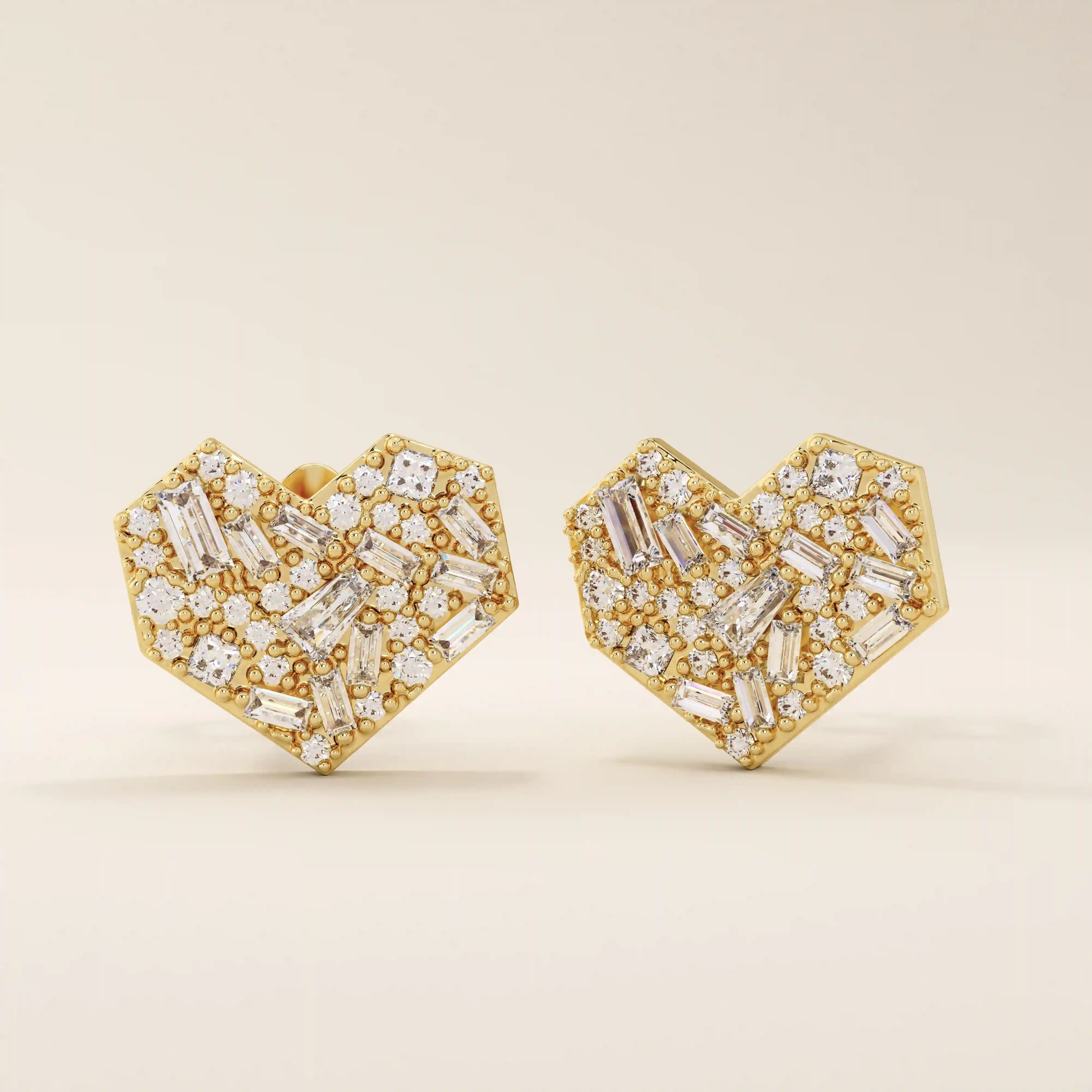 Angled view of 14k solid yellow gold heart studs, showing the intricate mix of baguette and round white moissanite stones for depth and shimmer.
