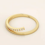This split band ring The band is adorned with sparkling stones unique split design modern 14k solid yellow gold stacking wedding ring