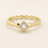 Bezel set princess square cut solitaire engagement ring in 14k solid gold. Sleek modern design for women.