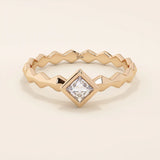 Bezel set princess square cut solitaire engagement ring in 14k solid gold. Sleek modern design for women.