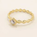 Bezel set princess square cut solitaire engagement ring in 14k solid gold. Sleek modern design for women.