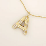 Bold initial necklace in 14k solid gold, fully pavé-set with shimmering moissanites. A statement-making personalized jewelry piece.