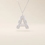 Bold initial necklace in 14k solid gold, fully pavé-set with shimmering moissanites. A statement-making personalized jewelry piece.