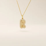 Bubble font initial pendant in 14k solid gold, framed with a halo of shimmering moissanites. A bold yet playful personalized necklace.