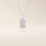 Bubble font initial pendant in 14k solid gold, framed with a halo of shimmering moissanites. A bold yet playful personalized necklace.