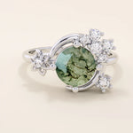 Chunky 14k gold ring with moss agate stone and celestial moon detail. Unique gemstone ring with natural patterns. Ideal for earthy and bold styles.