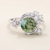 Chunky 14k gold ring with moss agate stone and celestial moon detail. Unique gemstone ring with natural patterns. Ideal for earthy and bold styles.