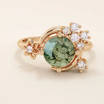 Chunky 14k gold ring with moss agate stone and celestial moon detail. Unique gemstone ring with natural patterns. Ideal for earthy and bold styles.
