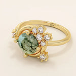 Chunky 14k gold ring with moss agate stone and celestial moon detail. Unique gemstone ring with natural patterns. Ideal for earthy and bold styles.