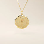 Close-up of a 14k solid gold pendant necklace with an embossed single rose and tiny moissanites. Romantic floral gold necklace for women. Perfect minimalist jewelry gift.