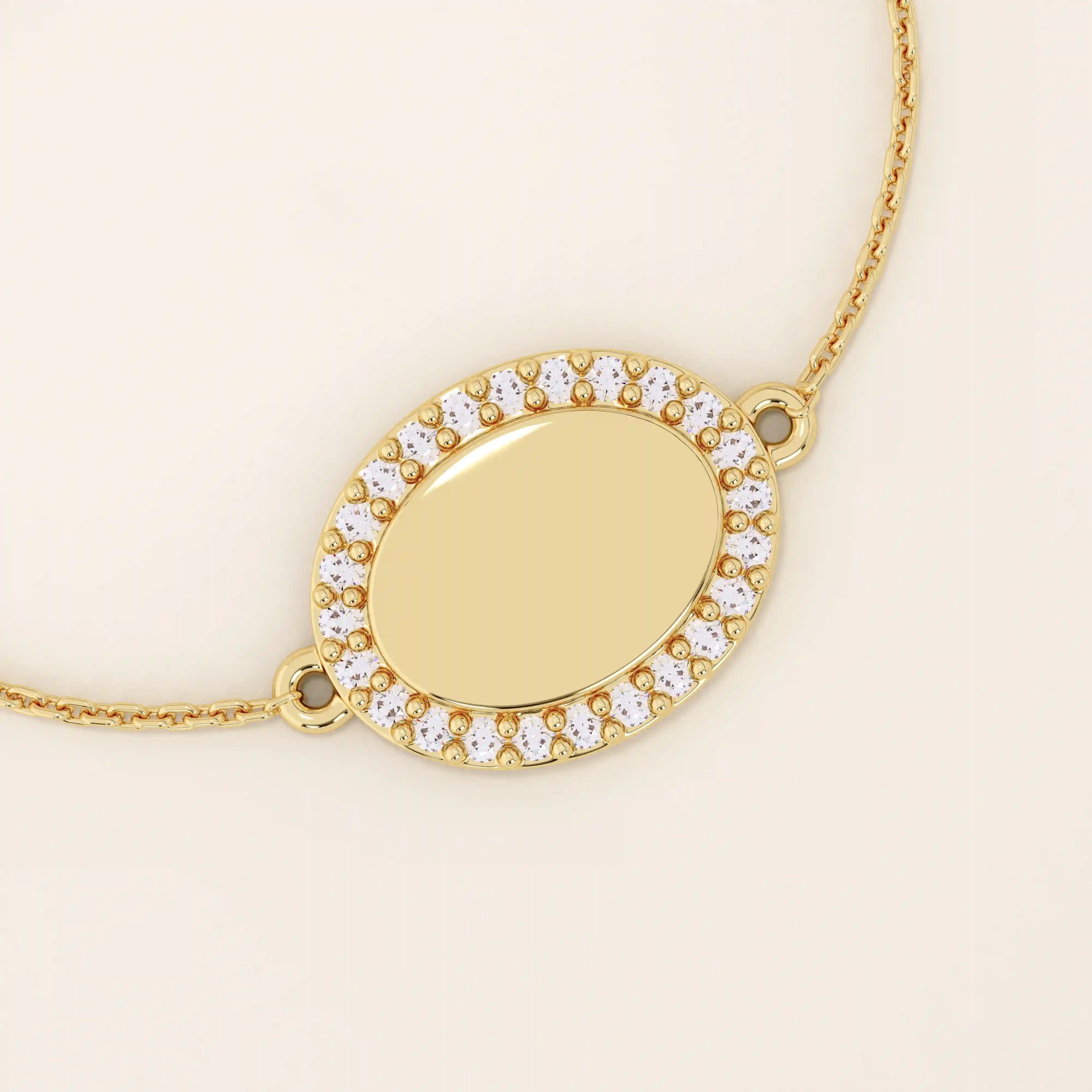 Close-up of an oval gold bracelet highlighting the pavé moissanite halo surrounding the polished oval centerpiece.
