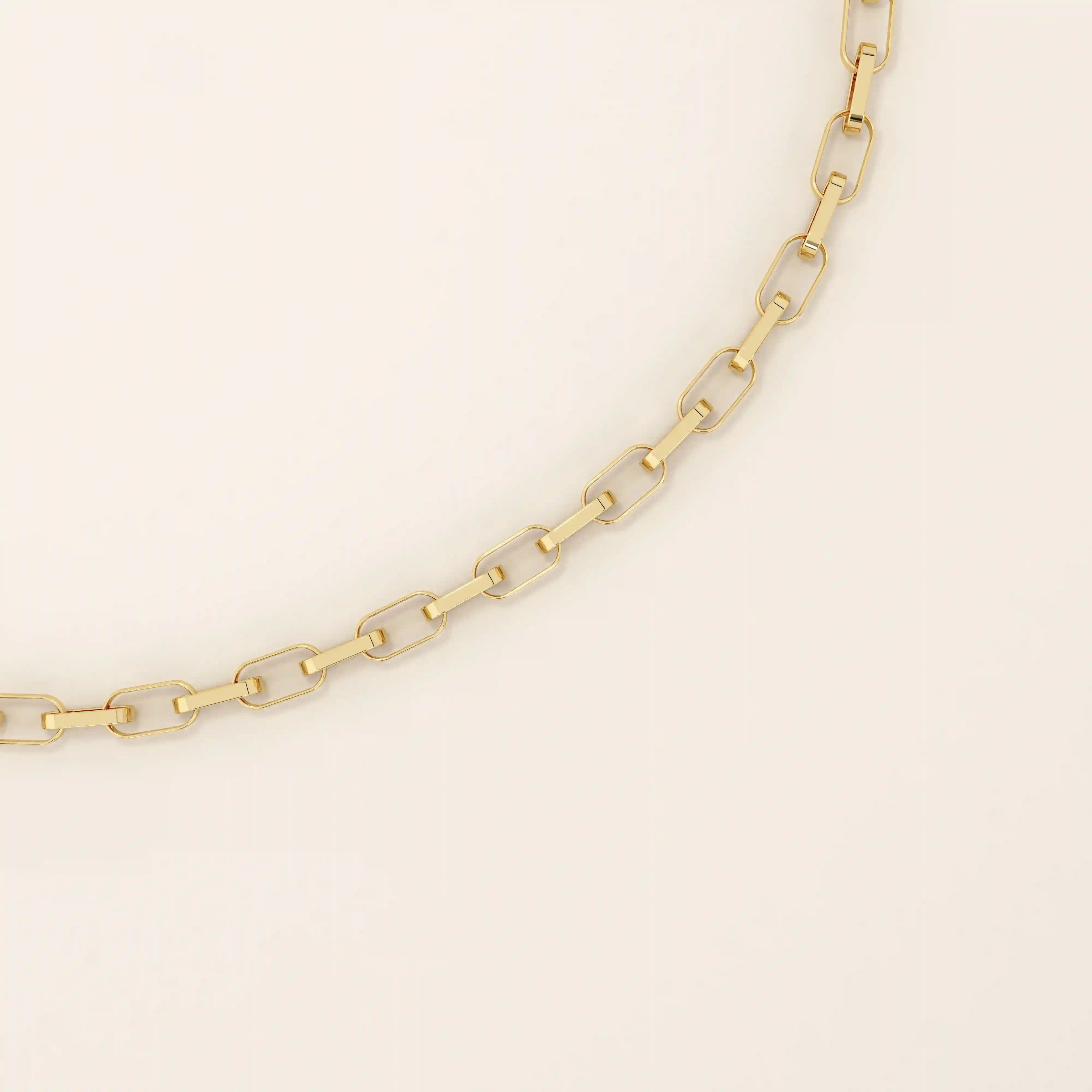 Close-up view of a 14k gold rolo chain bracelet showing the polished interlocking rectangular links.
