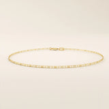 Close-up view of a 14k gold scroll chain bracelet showing the fine engraved rectangular scroll links.

