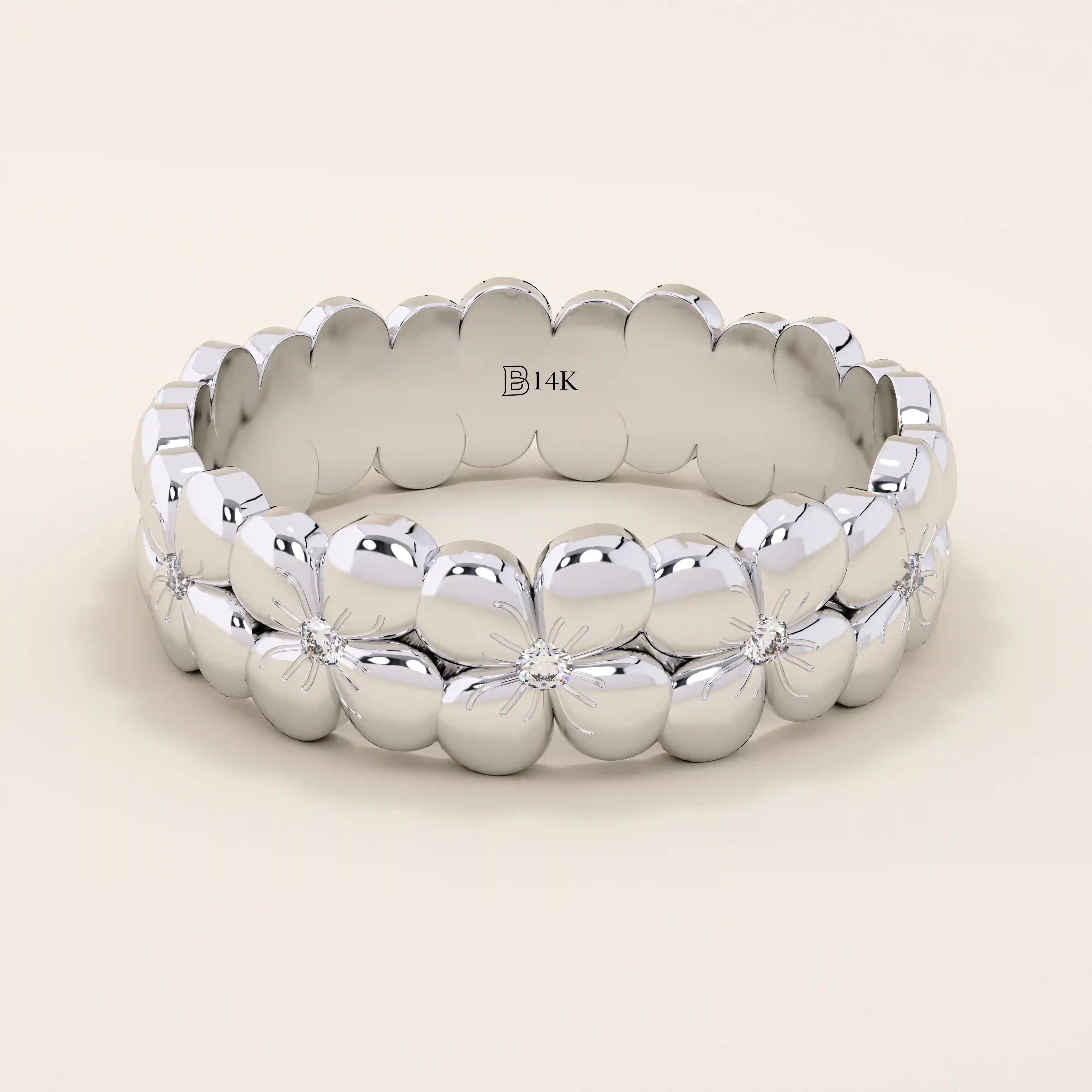 Daisy flower band ring in 14k solid gold, featuring tiny pavé moissanites. A thick yet delicate statement ring with floral charm.