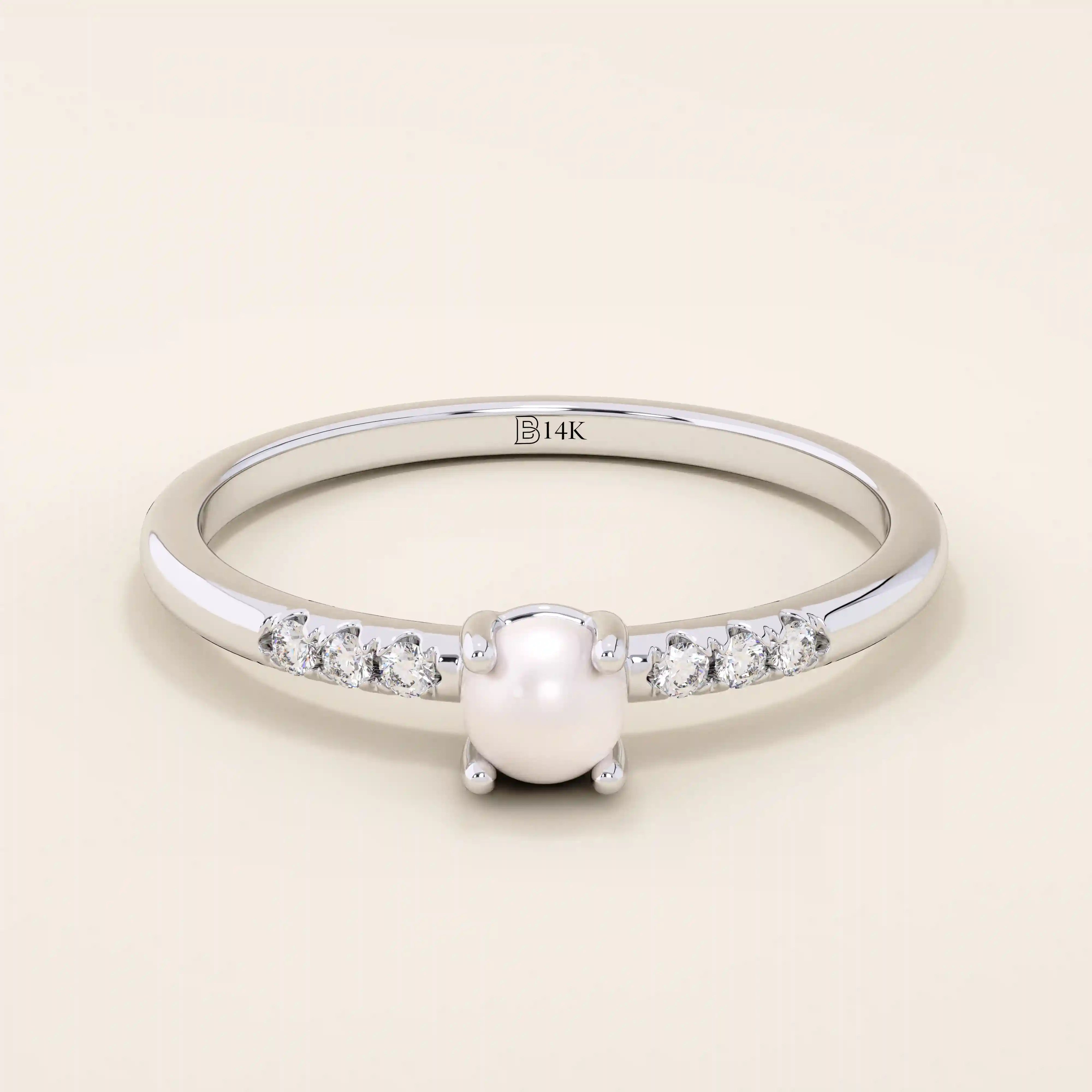 Delicate 14k solid gold promise ring featuring a small lustrous pearl. Minimalist and elegant design perfect for everyday wear.