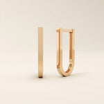 Elegant U-shape hoop earrings in 14k rose gold, featuring a polished contemporary design.
