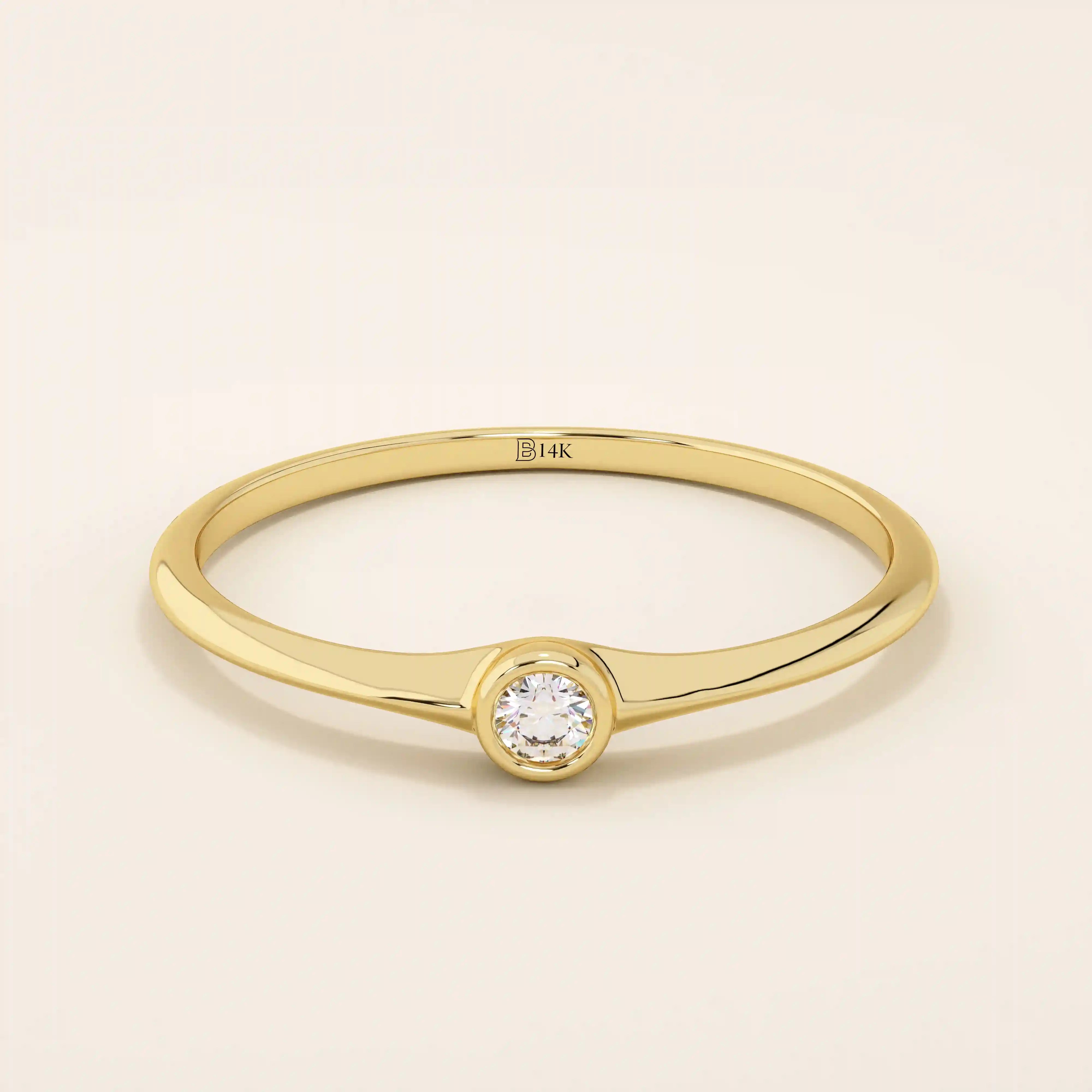 Minimalist 14k solid gold promise ring with a tiny bezel-set moissanite. Sleek and delicate design ideal for everyday wear.