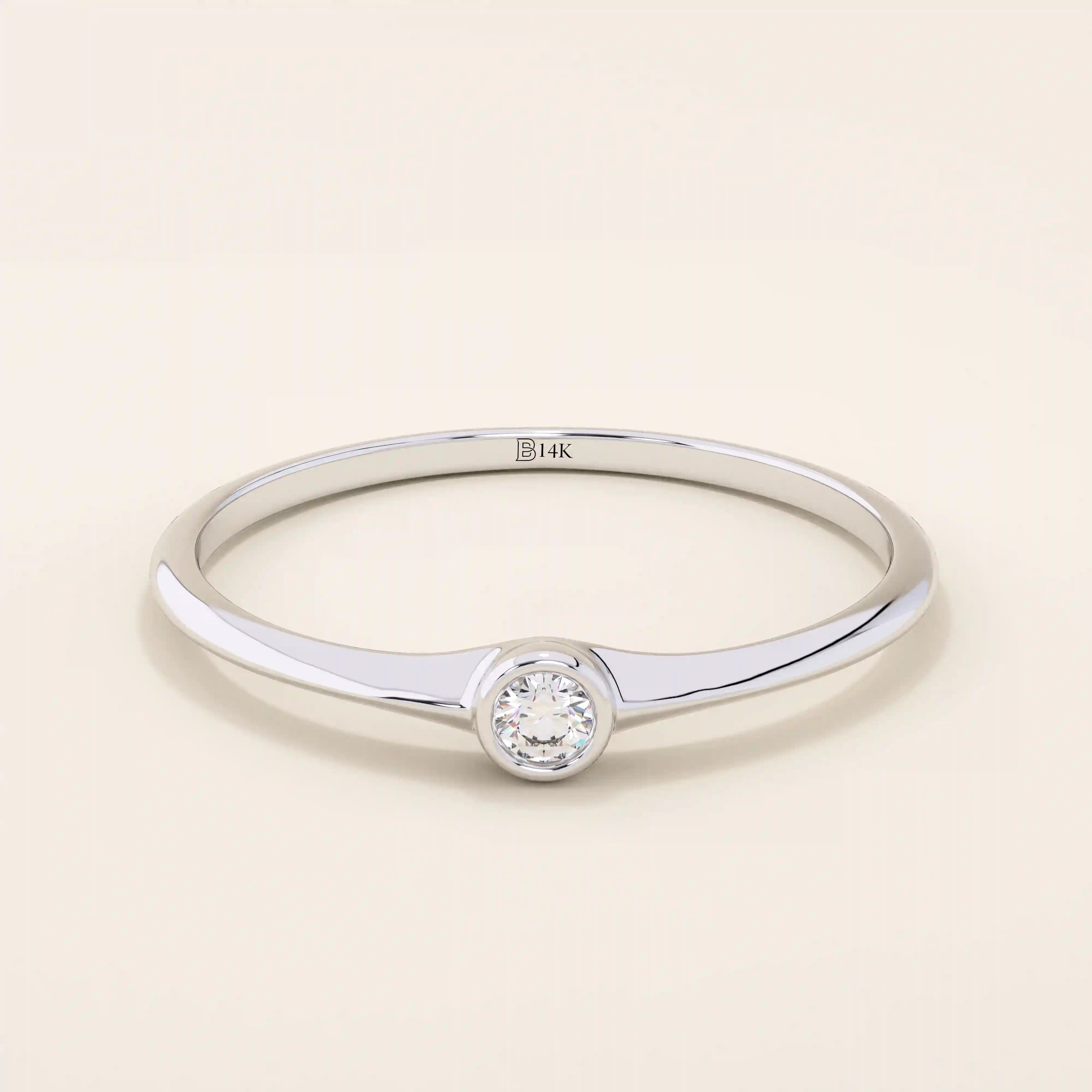 Minimalist 14k solid gold promise ring with a tiny bezel-set moissanite. Sleek and delicate design ideal for everyday wear.
