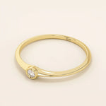Minimalist 14k solid gold promise ring with a tiny bezel-set moissanite. Sleek and delicate design ideal for everyday wear.