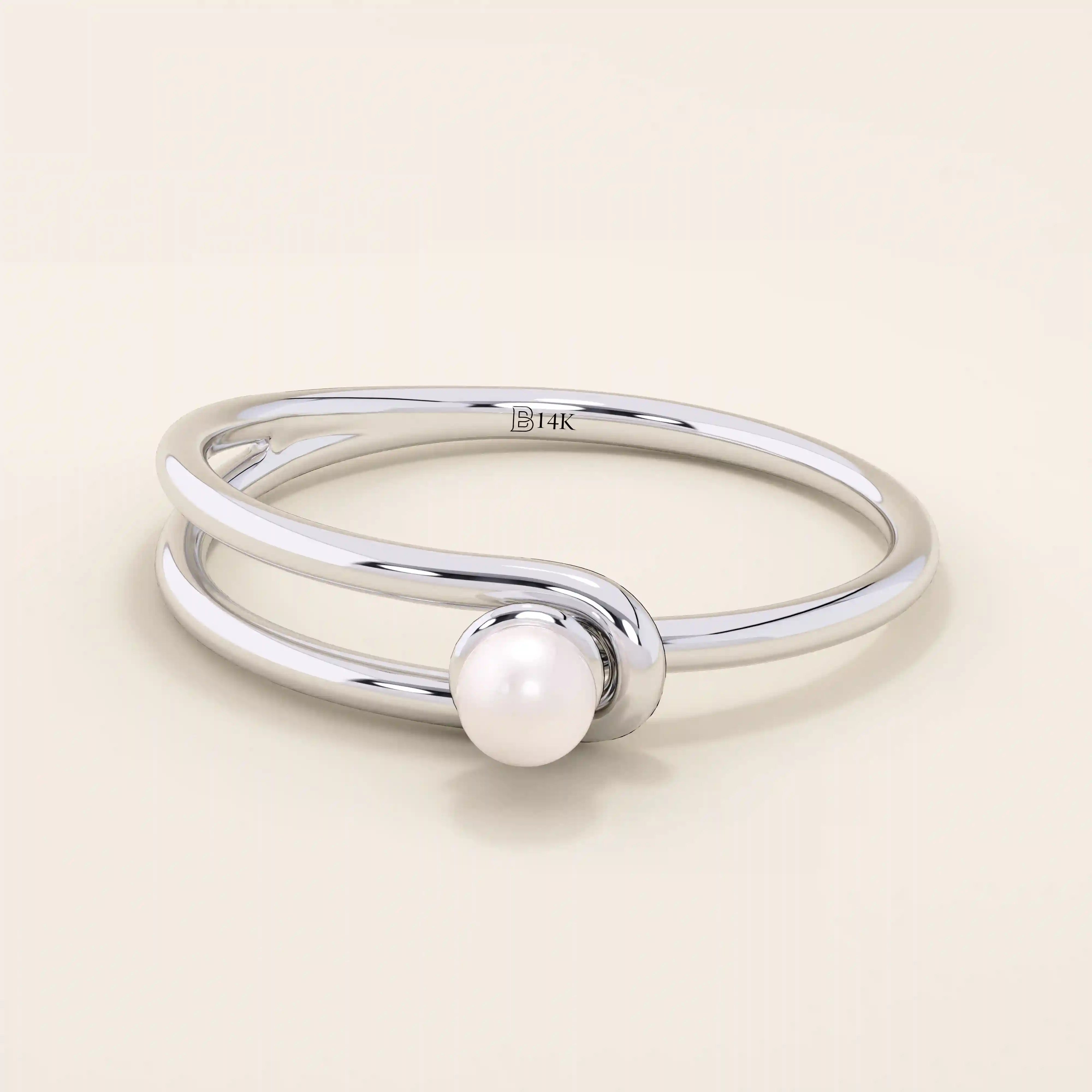 Minimalist 14k solid gold split band promise ring featuring a single lustrous pearl. Elegant design perfect for everyday wear or special occasions.